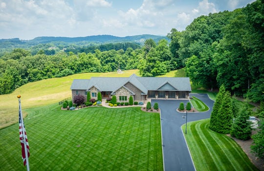 front of home, garage, front door, brick custom built home, 25.72+/- acres, mountain views, landscaping