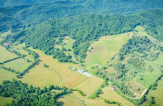 aerial view, mountains, pasture, trees, 198.92+/- acres, metal hay barn, event venue, craftsman style home