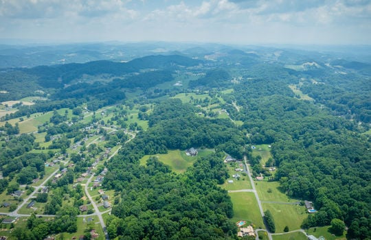 aerial view 25.72+/- acres, trees, woods, mountains, pasture, road, mountain views