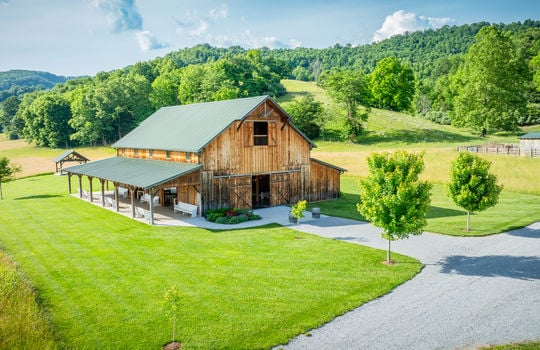 event venue barn, metal roof, landscaping, porch, mountain views, driveway, 198.92+/- acres
