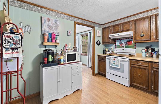 kitchen, vinyl flooring, range/oven, cabinets, countertops