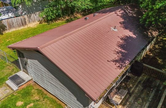 aerial view of home, roof, metal roof, vinyl siding