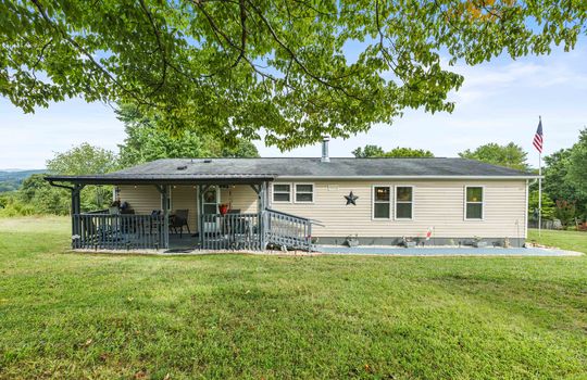 front yard, front porch, covered front oprch, front door, ramp, landscaping, vinyl siding