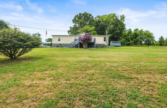 back yard, back deck, landscaping, doublewide, vinyl siding