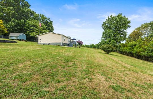 yard, side view of property, doublewide, vinyl siding