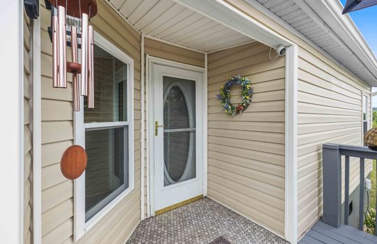 exterior door, wood deck, vinyl siding