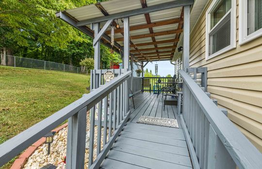 covered front porch, ramp, wood railings