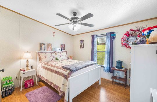 bedroom, ceiling fan, closet, luxury vinyl flooring, window