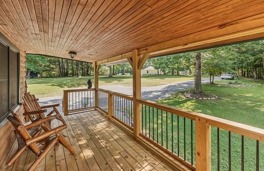 fully furnished log cabin, for lease only, front porch, front door, wood railing