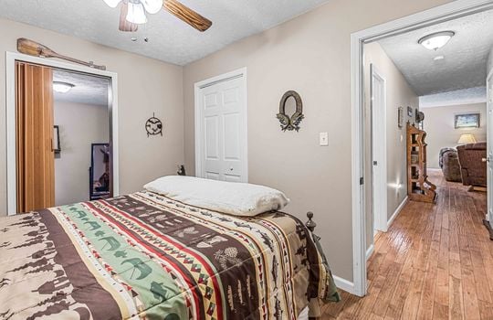 bedroom, hardwood flooring, closet, furnished, bed, ceiling fan