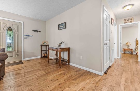 Front door, entry, foyer, log cabin, short or long term lease property, hardwood flooring