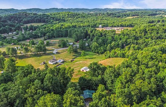 Aerial view of neighborhood, trees, mountains