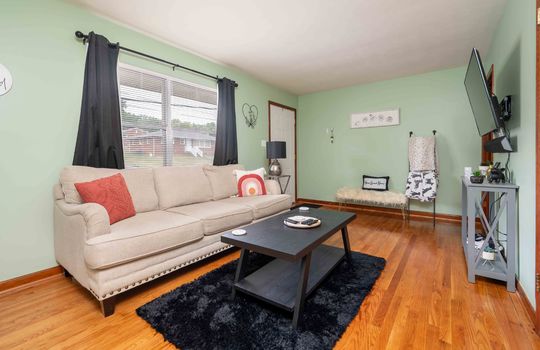 living room, hardwood flooring, window, front door