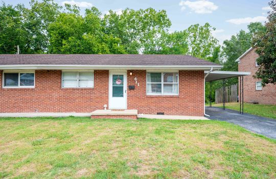 front yard, front door, window, brick exterior, duplex unit for sale