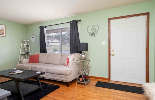 living room, hardwood flooring, window, front door