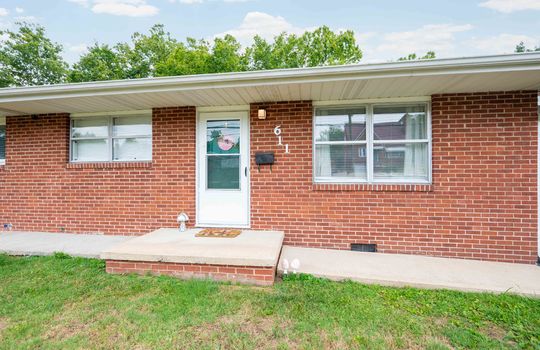 front yard, front door, window, brick exterior, duplex unit for sale