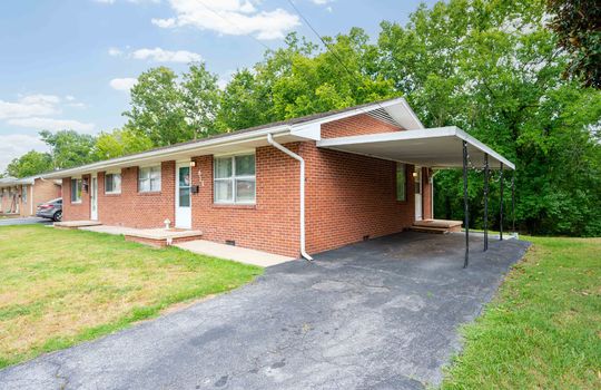 front yard, front door, window, brick exterior, duplex unit for sale, carport, driveway