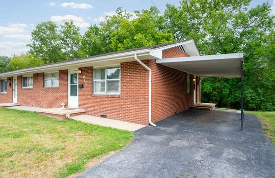 front yard, front door, window, brick exterior, duplex unit for sale, carport, driveway