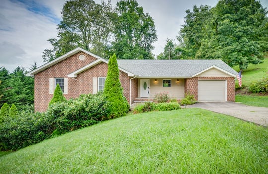 One story, brick home, front yard, landscaping, front door, driveway, 1 car attached garage