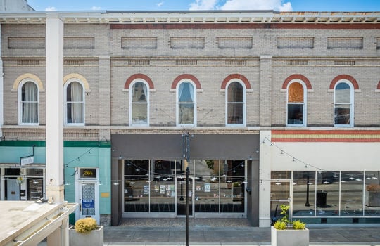 downtown loft, exterior, brick, street, lower level storefront, neighboring properties, street light