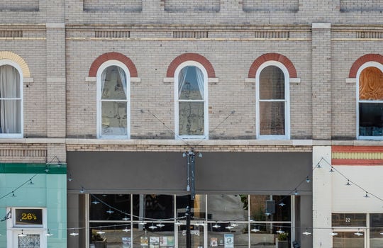 downtown loft, exterior, brick, street, lower level storefront, neighboring properties, street light