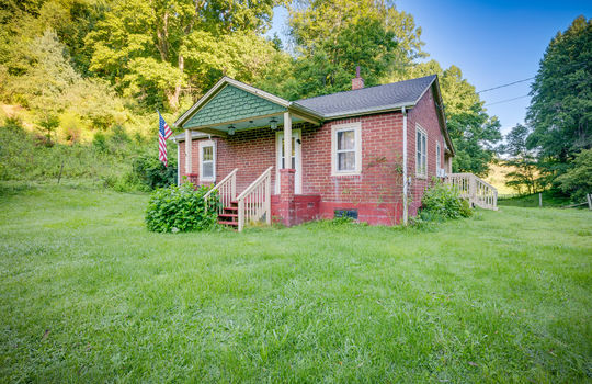 right side exterior view, brick, cottage, covered front porch, front steps, front door