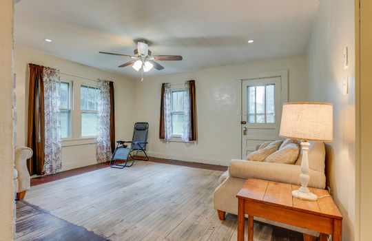 living room, hardwood flooring, ceiling fan