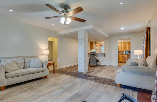 living room, ceiling fan, hardwood flooring/vinyl flooring, windows