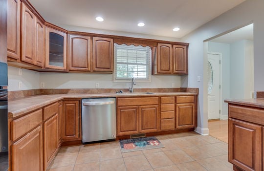 kitchen, tile flooring, cabinets, countertops, sink, dishwasher, window above sink, recessed lighting