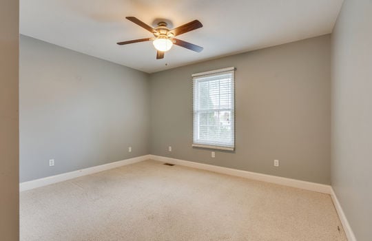 second bedroom, carpet, ceiling fan, window