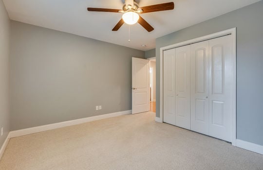 second bedroom, closet, ceiling fan, carpet