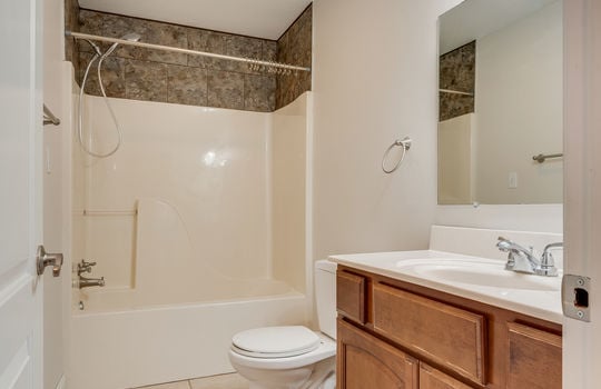 second bathroom, sink, toilet, shower/tub, tile flooring