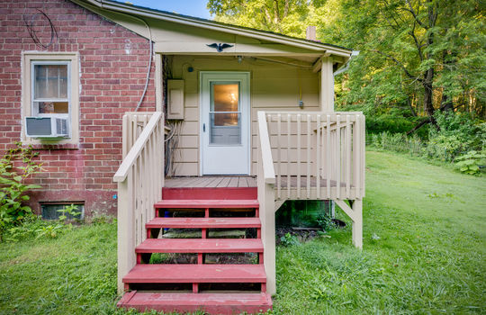 side porch, steps, exterior entry, railing, brick exterior