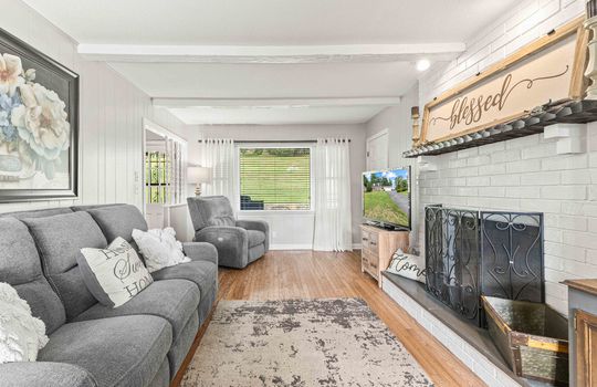 living room, fireplace, hardwood flooring, window