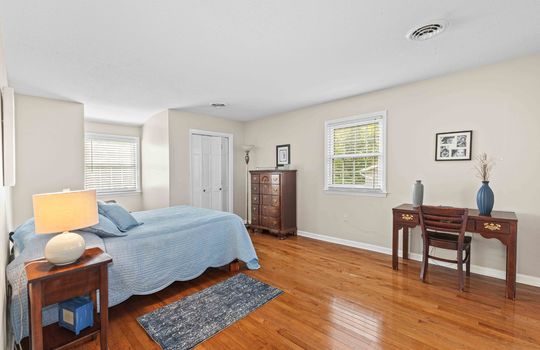 primary bedroom, closet, hardwood flooring