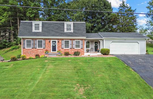 brick, Dutch Colonial, front yard, front door, landscaping, driveway, garage, garage door