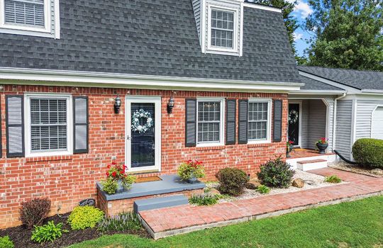 front yard, front door, sidewalk, brick dutch colonial home,