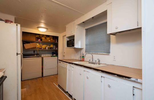 kitchen, sink, countertops, cabinets, laundry area in kitchen