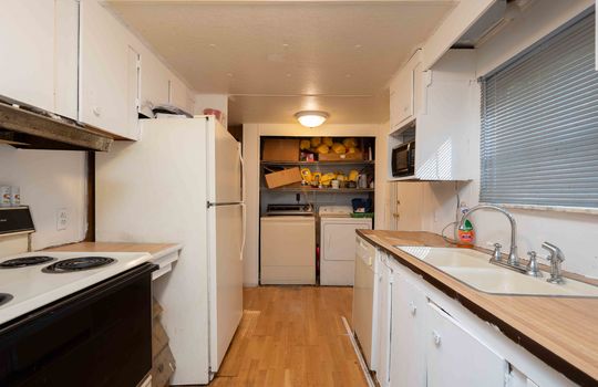 kitchen, oven/range, refrigerator, sink, laundry area in kitchen