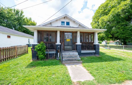 front view of home, cottage, vinyl siding, front porch, covered front porch, front door, concrete stairs