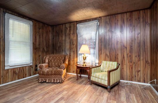 living room, paneling walls, laminate flooring, windows