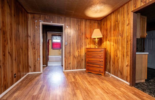 bedroom, laminate flooring, panelling walls