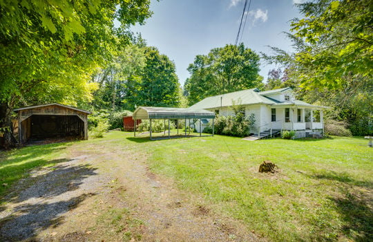 cottage, driveway, carport, front porch, front door, front yard, trees