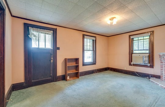 living room, front door, windows, carpet