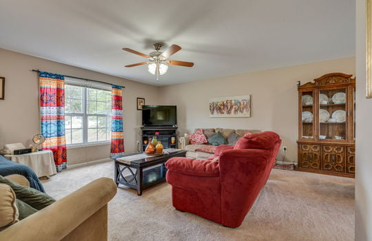 living room, carpet, ceiling fan, windows