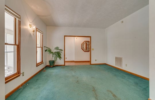 formal living room, door to hallway, windows