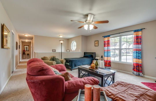 living room, ceiling fan, carpet, windows