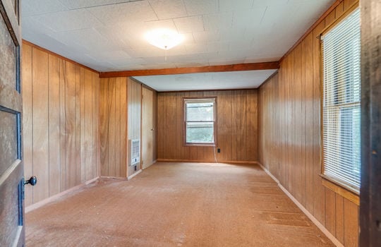 bedroom, carpet, paneling walls, closet