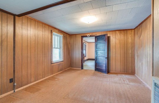 bedroom, carpet, paneling walls