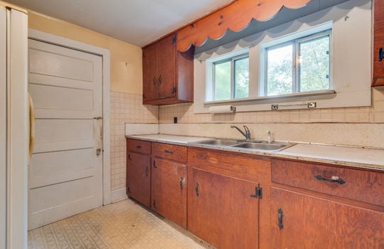 kitchen, cabinets, counters, vinyl flooring, window above sink, sink